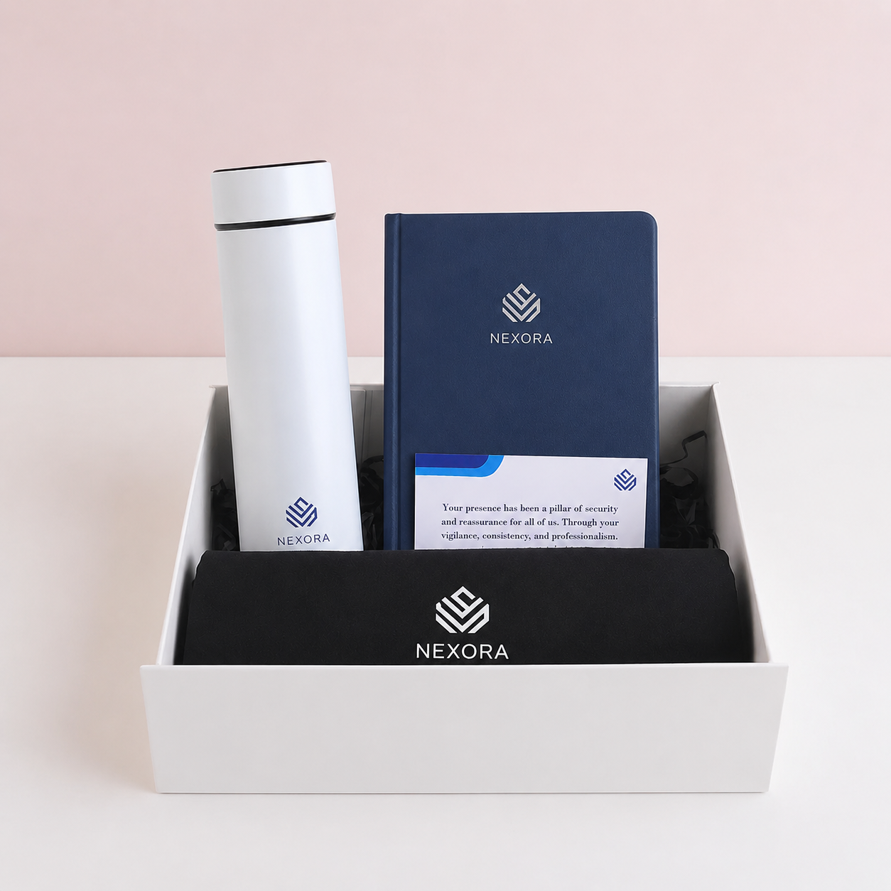 YC-002 Nexora corporate gift set YC-002 Nexora corporate gift set featuring a white stainless steel digital thermal flask, navy blue PU Leather A5 notebook, black canvas tote bag, and personalized greeting card arranged neatly inside a white gift box with custom company branding.